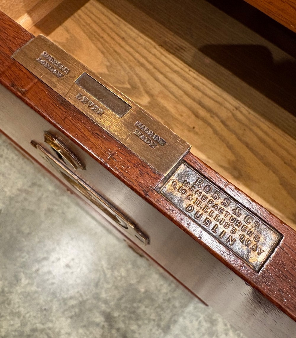 A Victorian two-part mahogany military campaign chest featuring two short over three long drawers with flush brass handles and brass corner straps. View IX