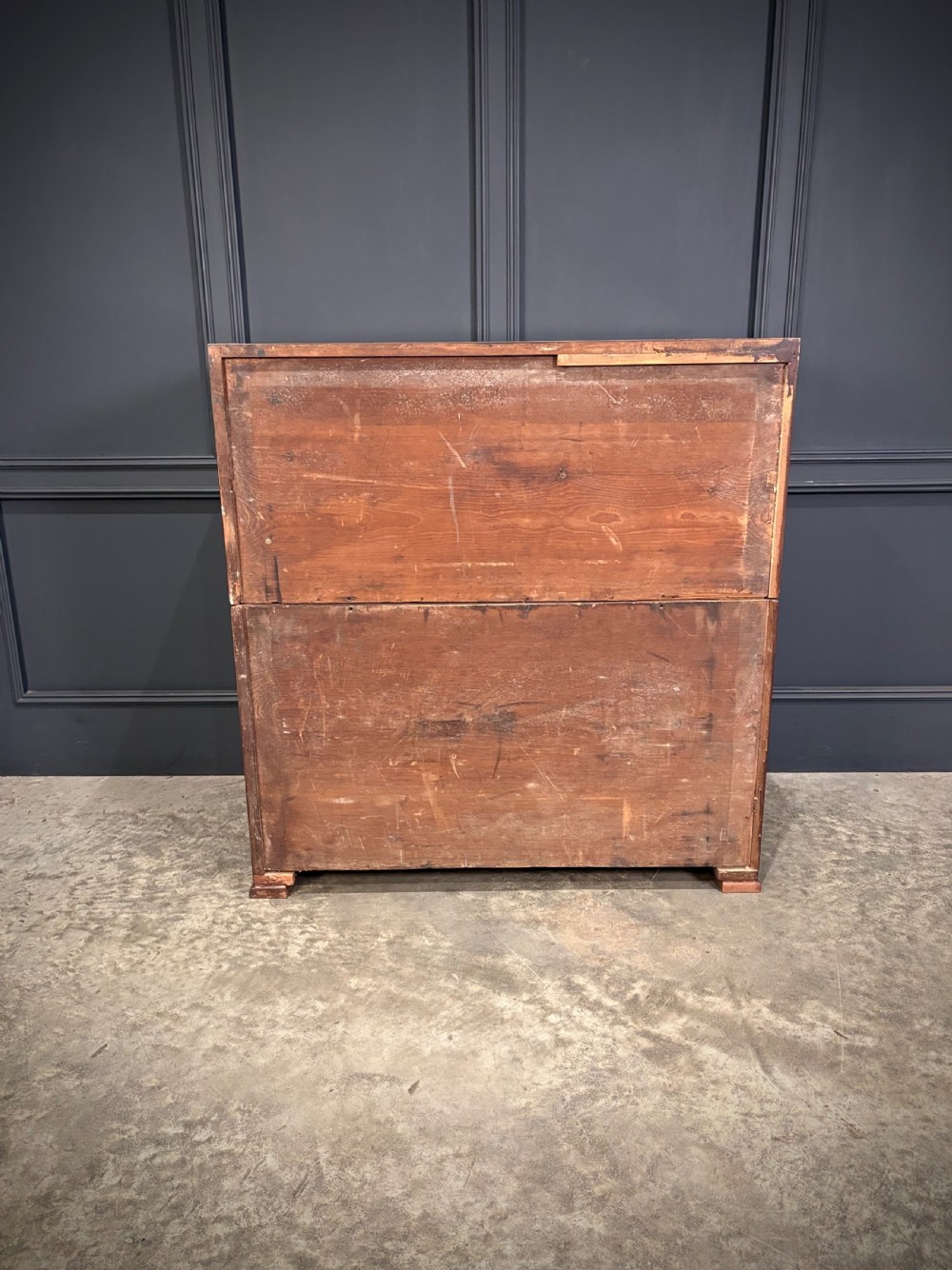 A Victorian two-part mahogany military campaign chest featuring two short over three long drawers with flush brass handles and brass corner straps. View XIV