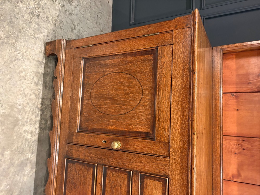 An eighteenth-century oak welsh dresser featuring a three-shelf open upper rack and a lower base with three drawers and two panelled cupboard doors. View X