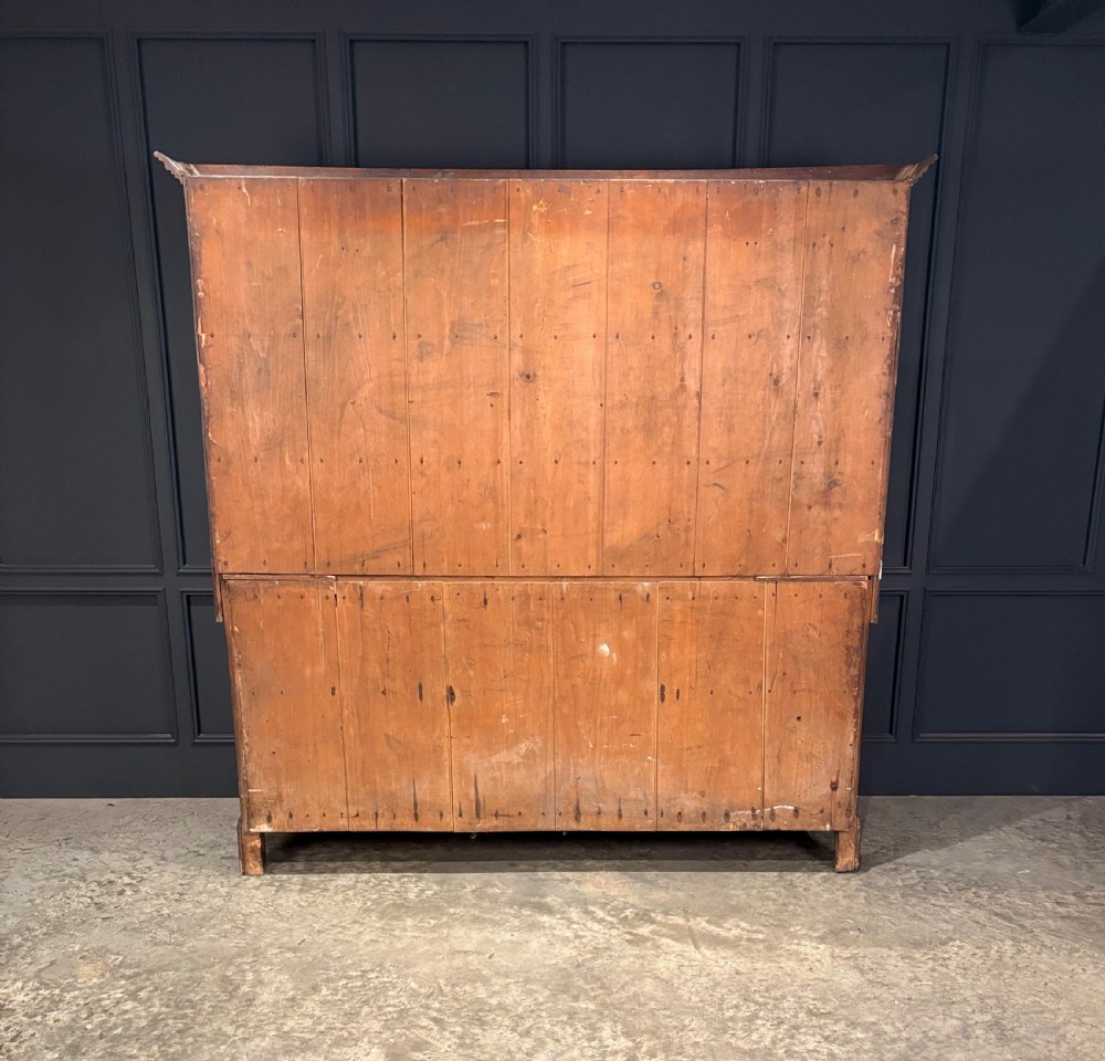 An eighteenth-century oak welsh dresser featuring a three-shelf open upper rack and a lower base with three drawers and two panelled cupboard doors. View XIV