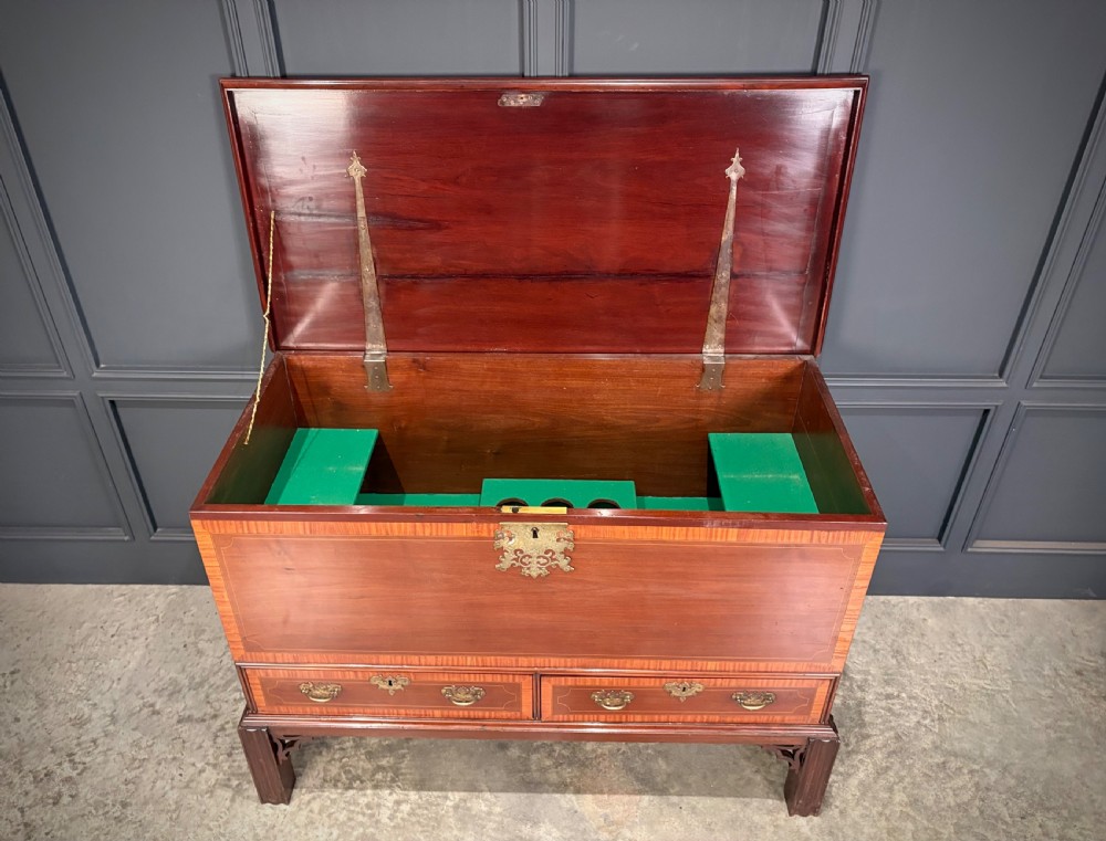 A Georgian inlaid mahogany silver chest on stand featuring satinwood crossbanding, brass side carrying handles, two lower drawers, and square legs with bracket corner supports. View VII