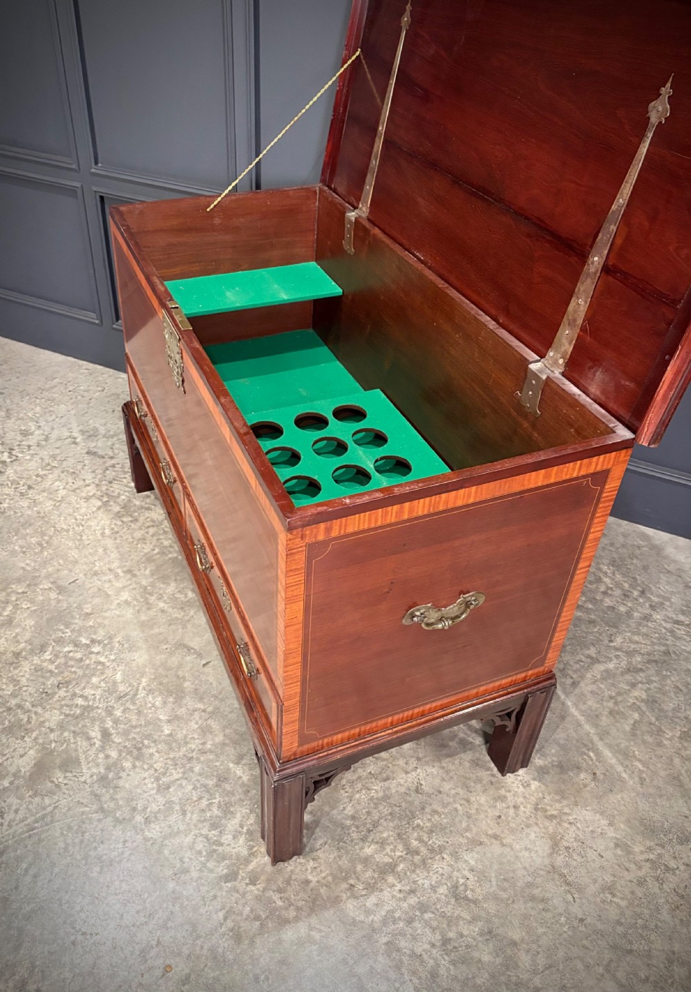 A Georgian inlaid mahogany silver chest on stand featuring satinwood crossbanding, brass side carrying handles, two lower drawers, and square legs with bracket corner supports. View XII