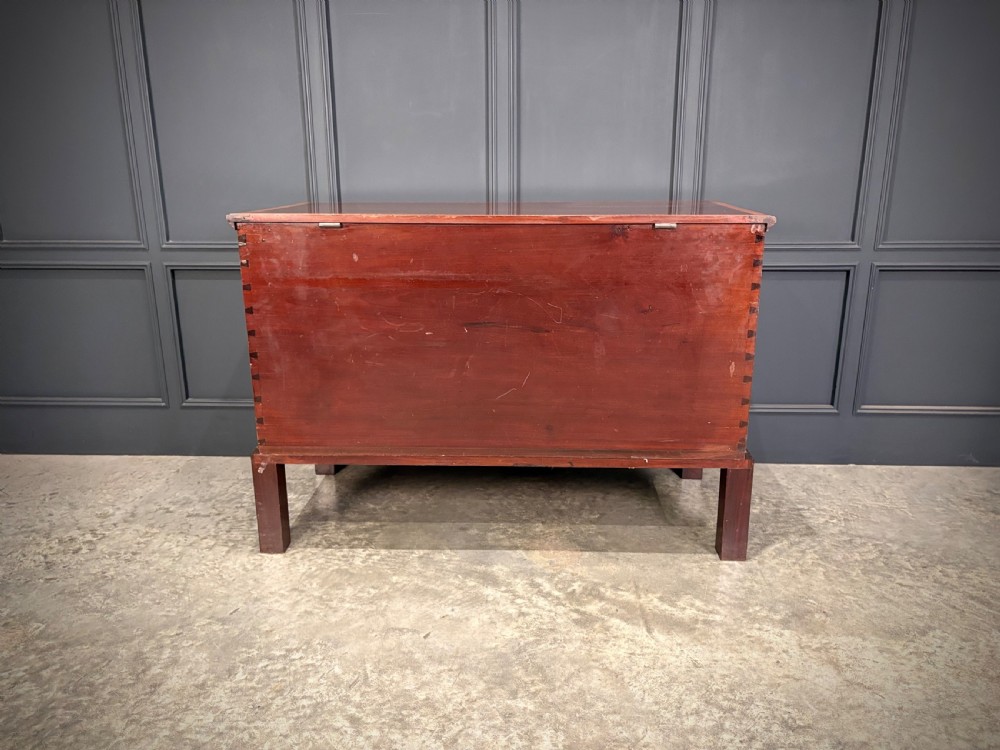 A Georgian inlaid mahogany silver chest on stand featuring satinwood crossbanding, brass side carrying handles, two lower drawers, and square legs with bracket corner supports. View XV
