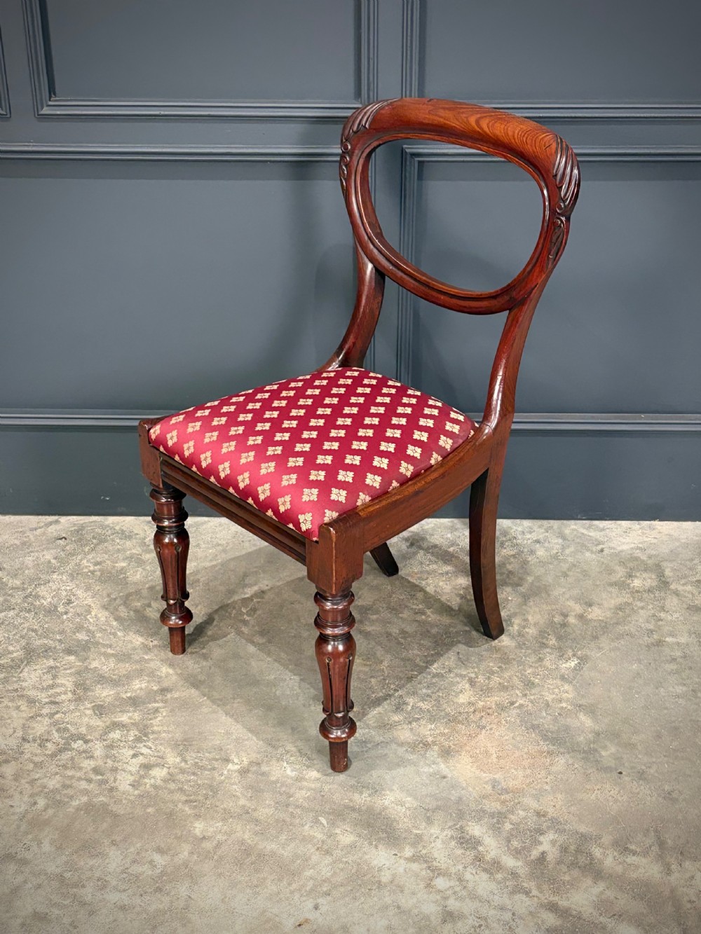A pair of Victorian mahogany side chairs with rounded balloon backs, turned front legs, and red patterned fabric seats. View XI