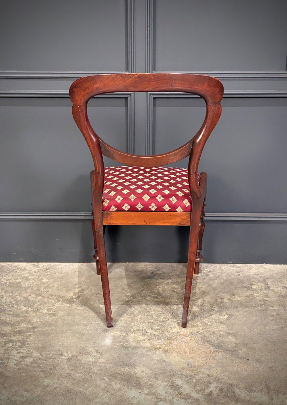 A pair of Victorian mahogany side chairs with rounded balloon backs, turned front legs, and red patterned fabric seats. View XIV