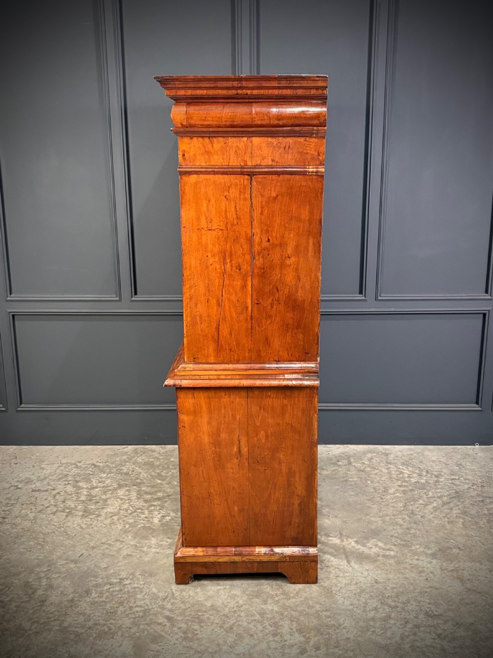 An antique Queen Anne walnut escritoire featuring a drop-front writing surface revealing a fitted interior above a base with drawers. View XIII