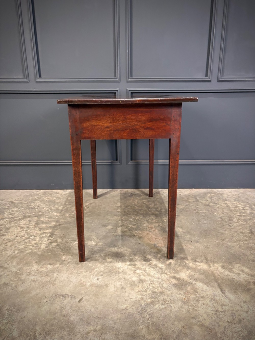 A Georgian mahogany side table featuring two front drawers with oval brass handles and straight square tapered legs. View VIII