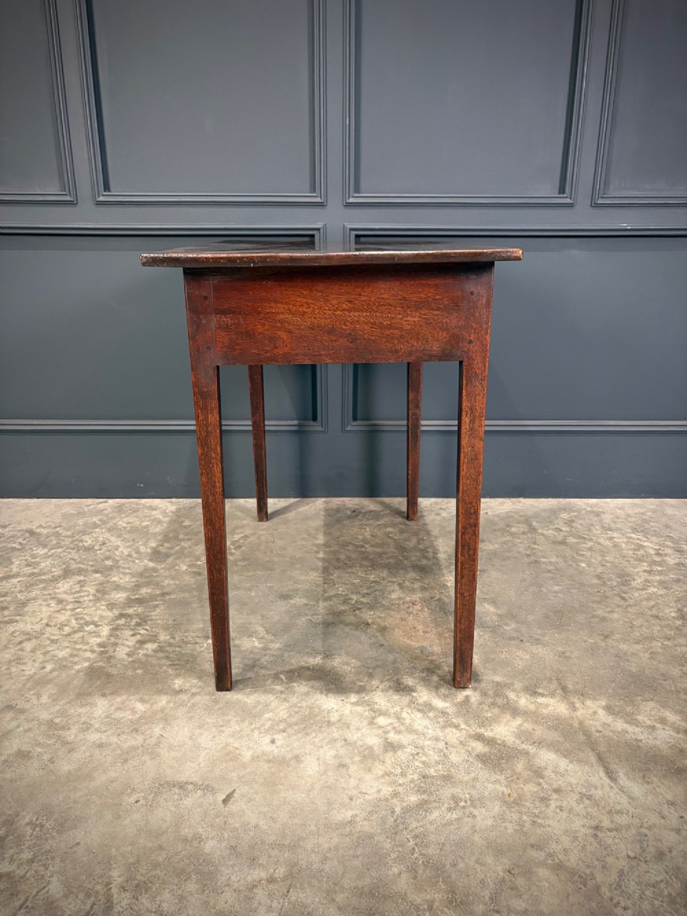 A Georgian mahogany side table featuring two front drawers with oval brass handles and straight square tapered legs. View X
