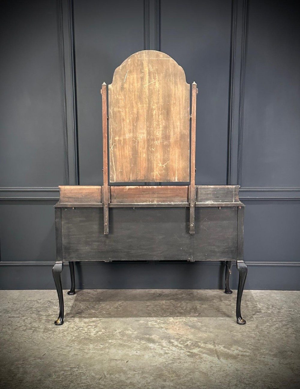 A black lacquered Chinoiserie dressing table featuring gilt hand-painted figures and landscapes, five drawers, cabriole legs, and an arched mirror attached to the top. View VII