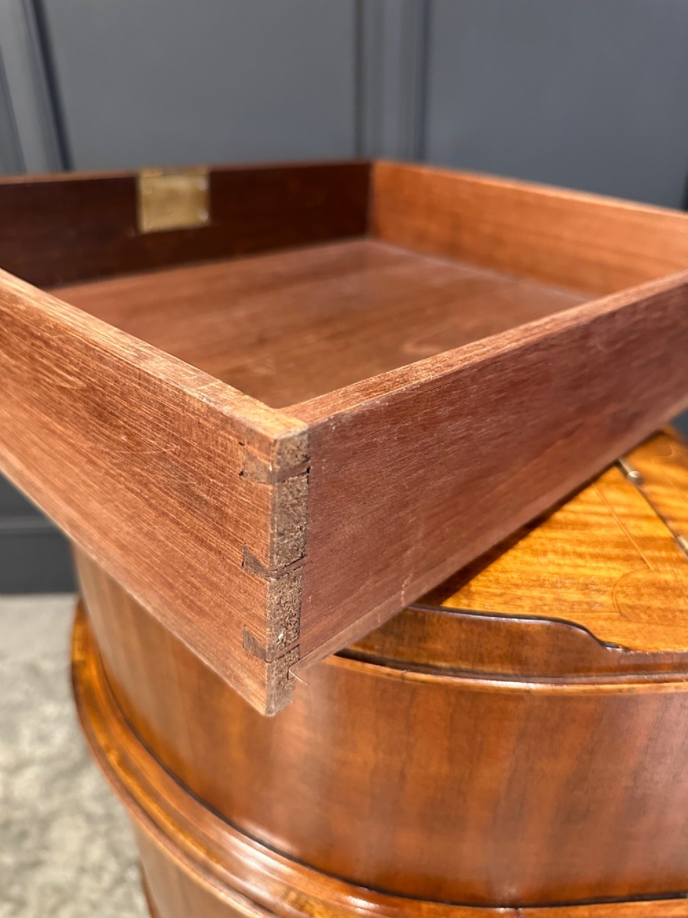 An inlaid mahogany Carlton House writing desk featuring a curved gallery with small drawers and cupboards above a green leather writing surface and square tapered legs. View XIII