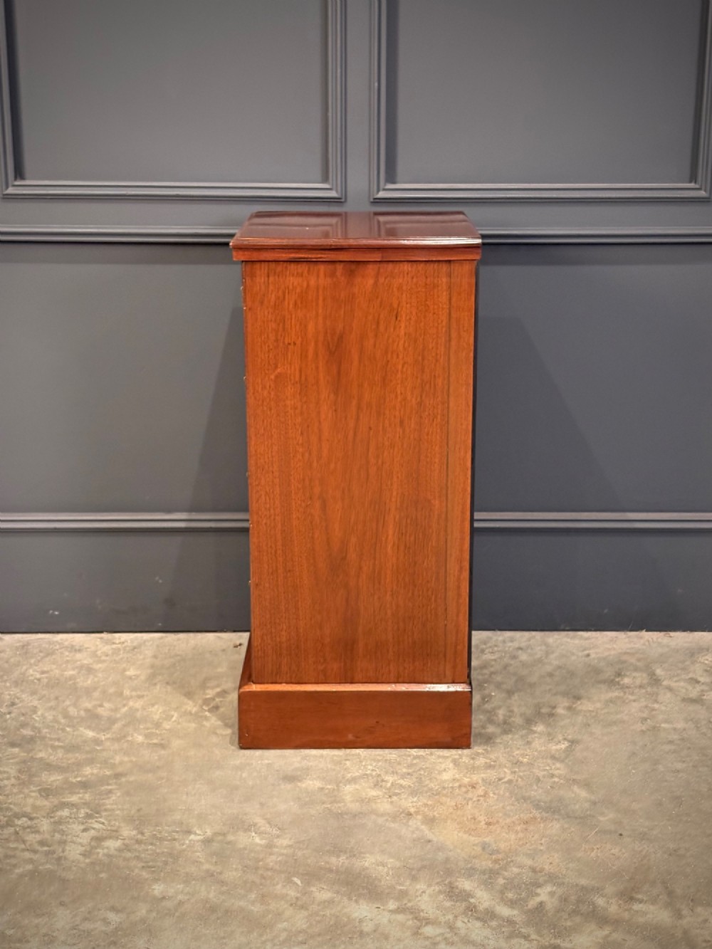 A pair of matching Victorian walnut bedside chests featuring four drawers each, brass drop handles, and a solid plinth base. View IX