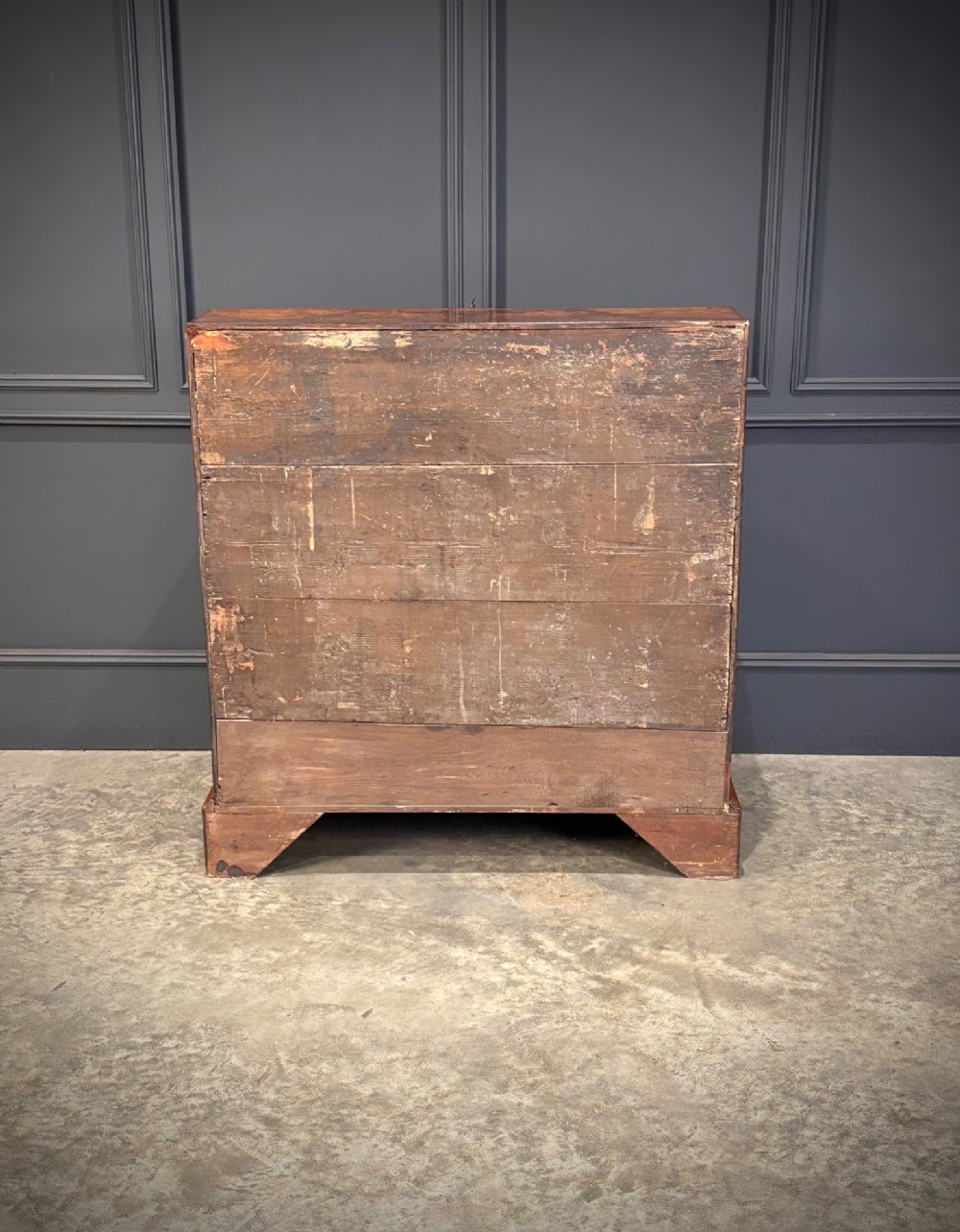 A Queen Anne style writing bureau crafted from figured walnut with a slant front writing flap above two short and two long drawers. View IX