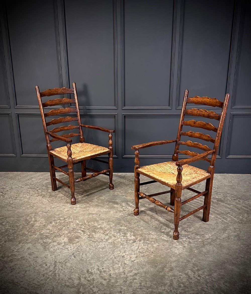 A set of eight dark oak ladder back dining chairs featuring woven rush seats, shaped back slats, and turned front legs. View VIII