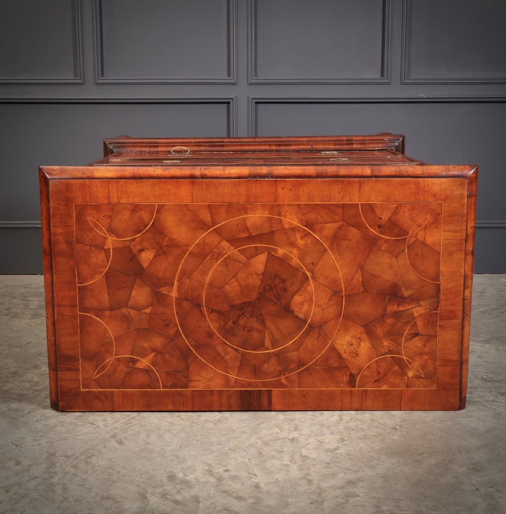 A 17th-century William and Mary chest of drawers featuring geometric oyster veneer, boxwood stringing, brass drop handles, and turned bun feet. View IX
