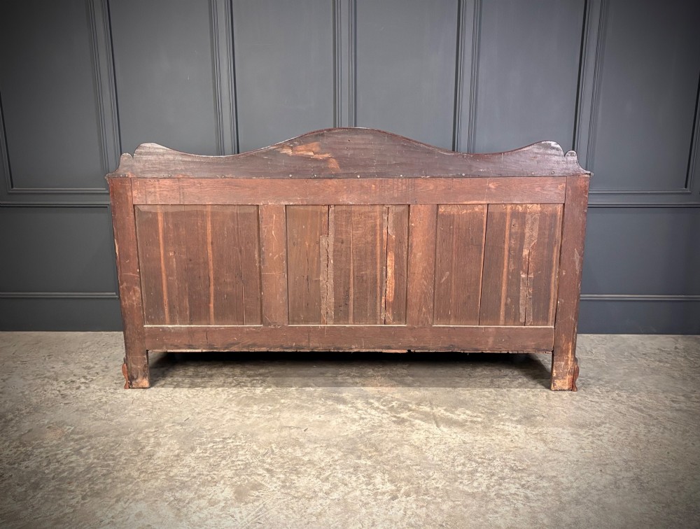 An 18th-century mahogany bank of nine drawers featuring a shaped upstand gallery back, brass swan-neck handles, and bracket feet. View IX