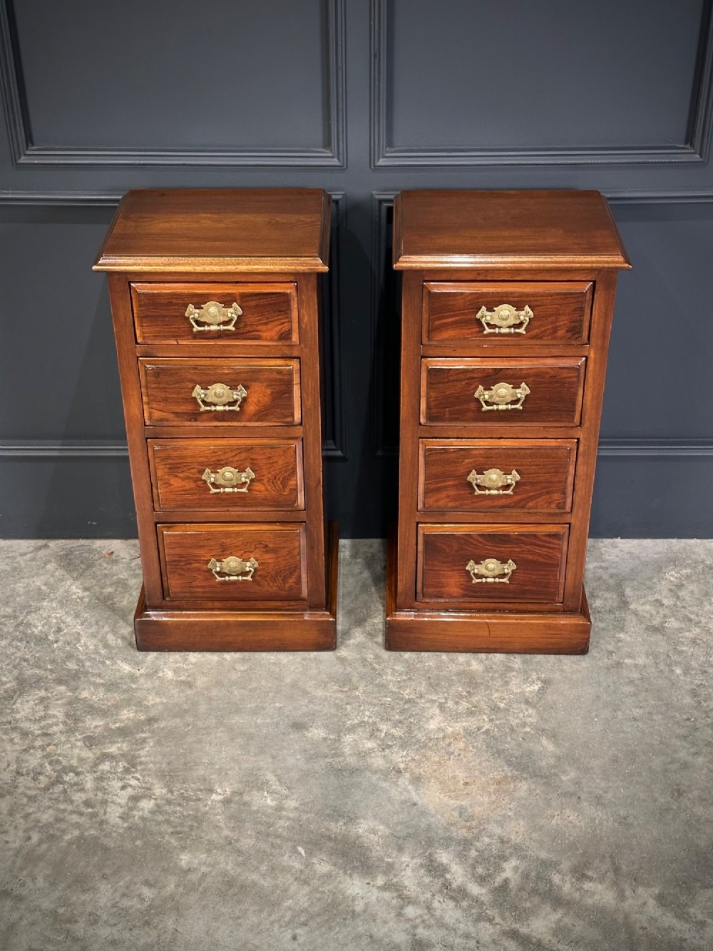A pair of tall Edwardian mahogany and rosewood four-drawer bedside chests with brass drop handles and plinth bases. View III
