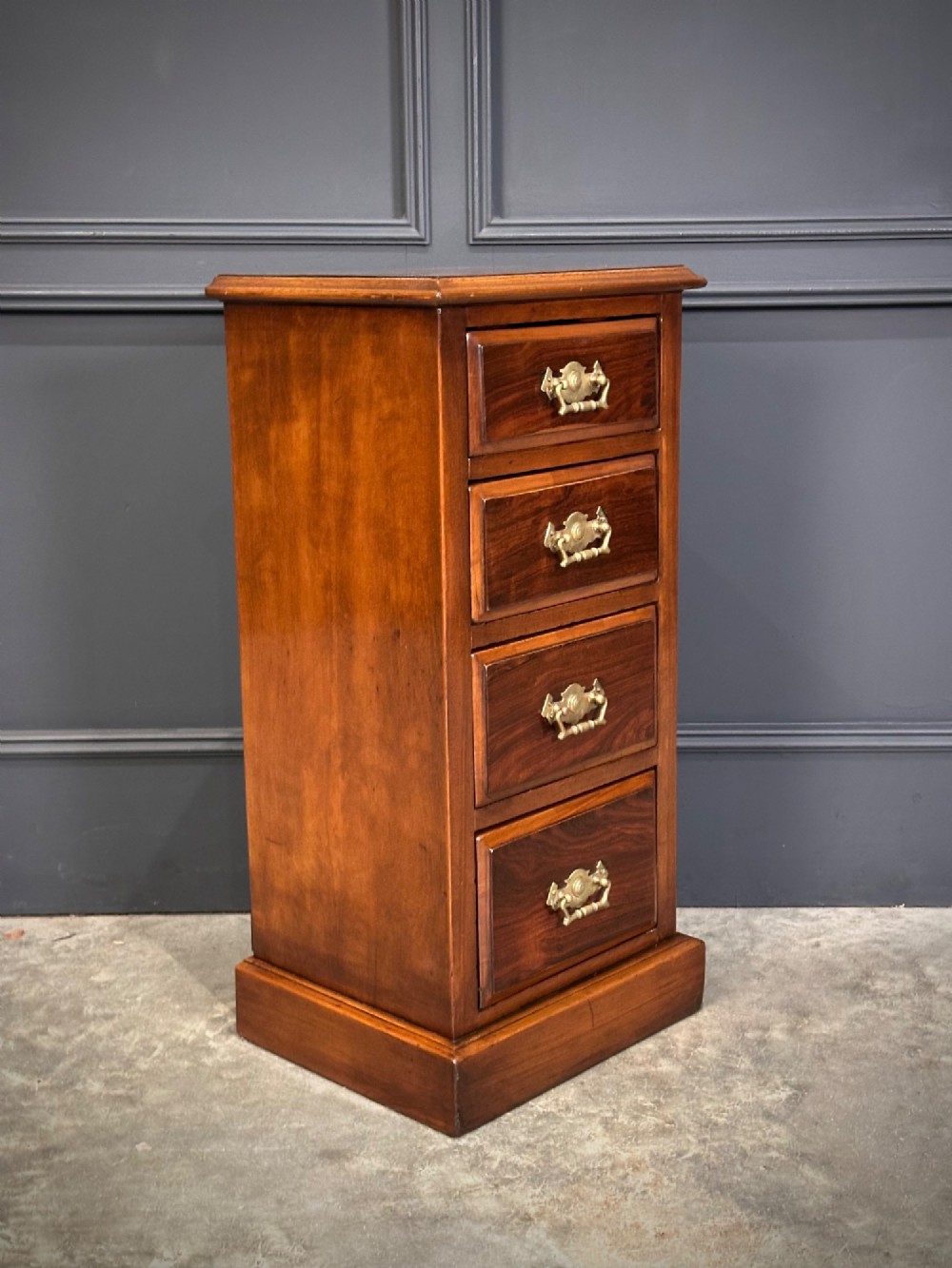 A pair of tall Edwardian mahogany and rosewood four-drawer bedside chests with brass drop handles and plinth bases. View VI