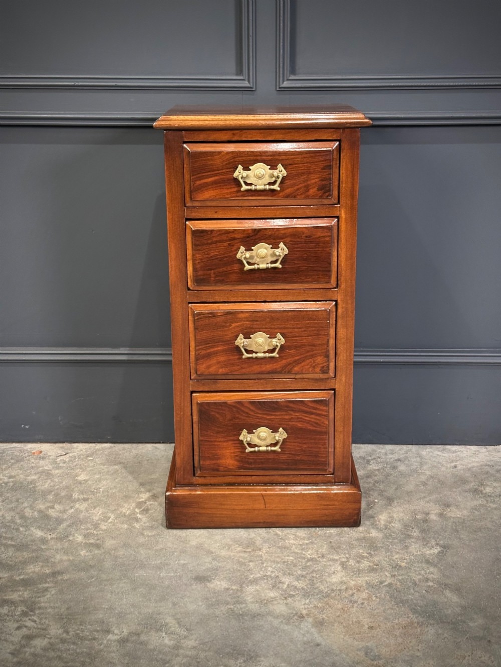 A pair of tall Edwardian mahogany and rosewood four-drawer bedside chests with brass drop handles and plinth bases. View VII