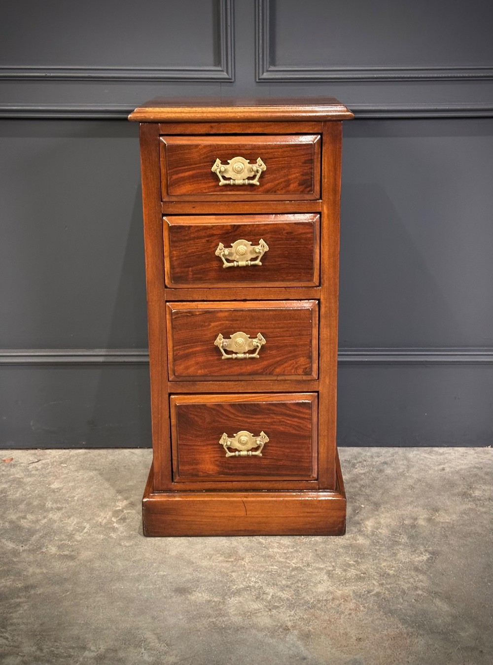 A pair of tall Edwardian mahogany and rosewood four-drawer bedside chests with brass drop handles and plinth bases. View IX
