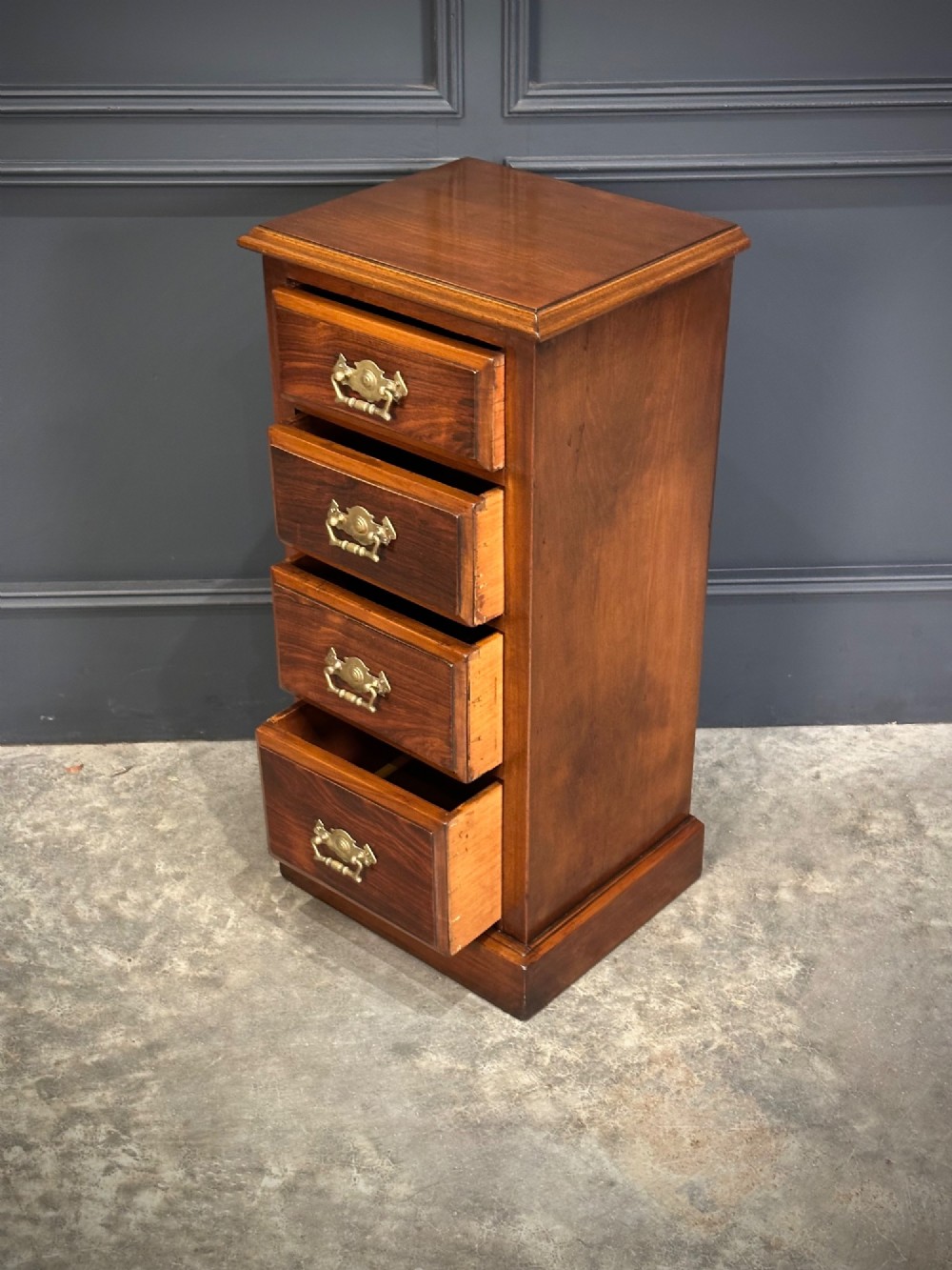 A pair of tall Edwardian mahogany and rosewood four-drawer bedside chests with brass drop handles and plinth bases. View XII