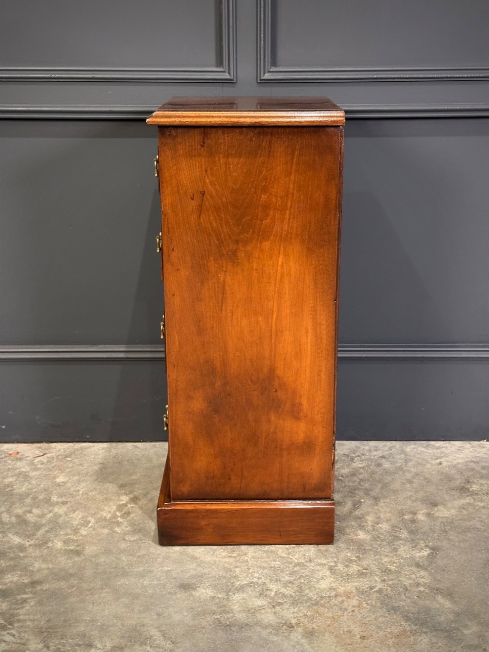 A pair of tall Edwardian mahogany and rosewood four-drawer bedside chests with brass drop handles and plinth bases. View XIII
