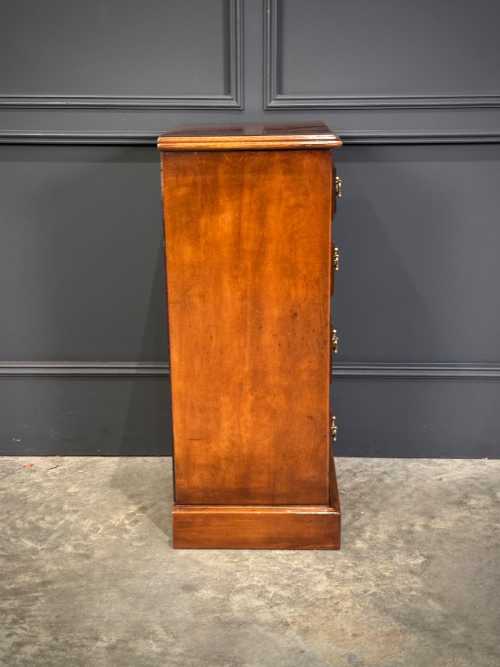 A pair of tall Edwardian mahogany and rosewood four-drawer bedside chests with brass drop handles and plinth bases. View XV
