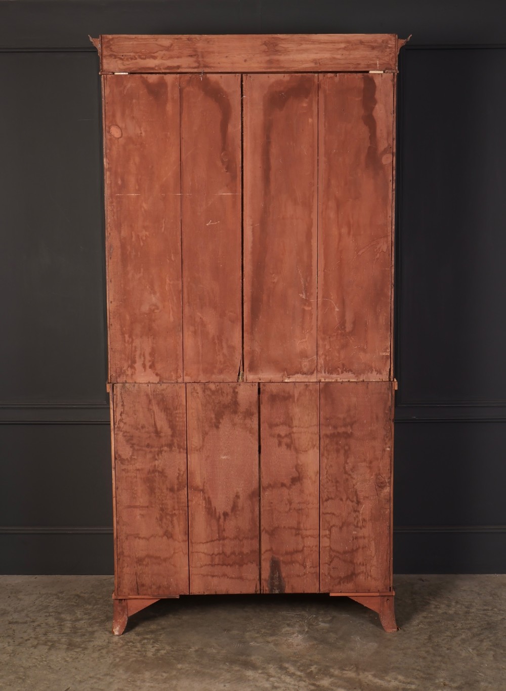 A tall Georgian satinwood secretaire bookcase featuring an upper glazed cabinet with geometric astragal bars, a fold-down desk drawer, and a lower double-door cupboard on splayed bracket feet. View XI