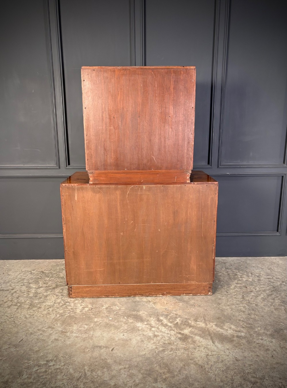 An Art Deco two-tiered cocktail cabinet in figured walnut veneer featuring double doors and geometric paneling. View XIII