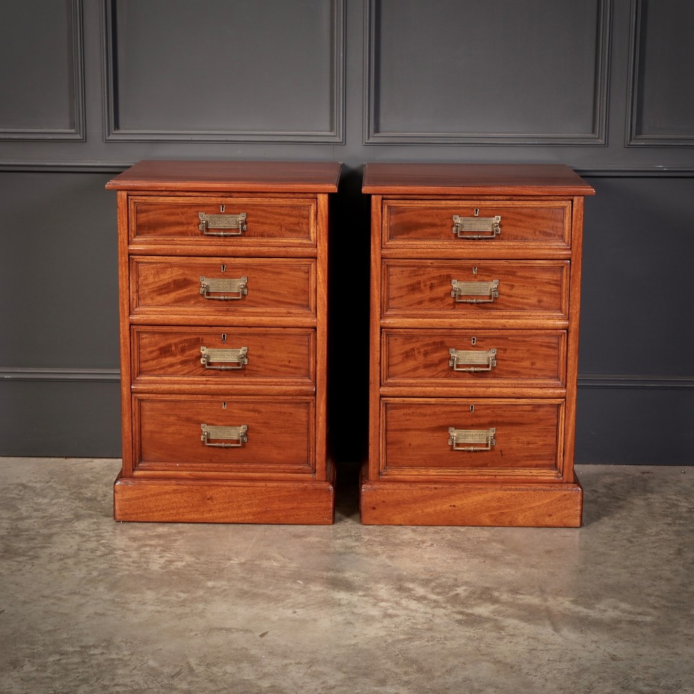 A matching pair of antique Victorian mahogany four-drawer bedside chests featuring plinth bases and brass card-pull handles. View III