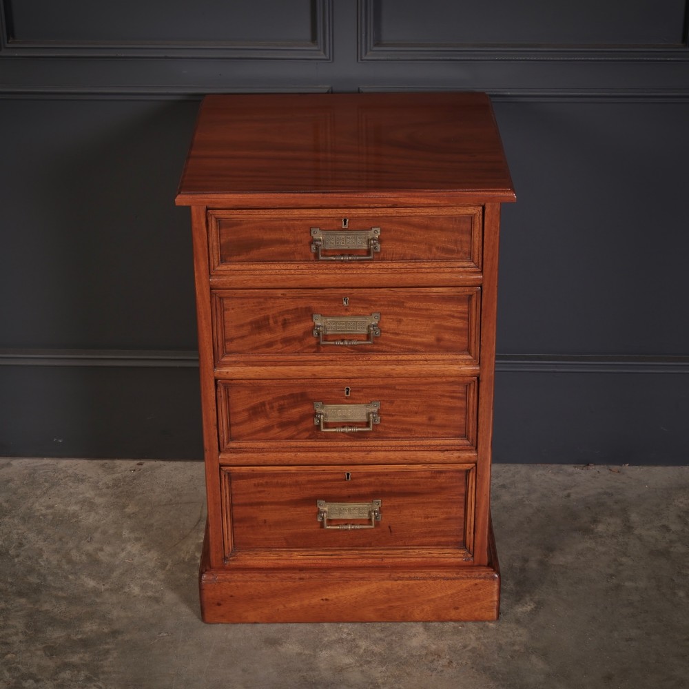 A matching pair of antique Victorian mahogany four-drawer bedside chests featuring plinth bases and brass card-pull handles. View VII