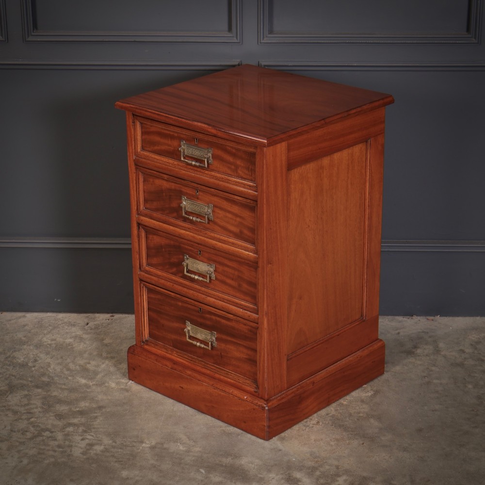 A matching pair of antique Victorian mahogany four-drawer bedside chests featuring plinth bases and brass card-pull handles. View IX