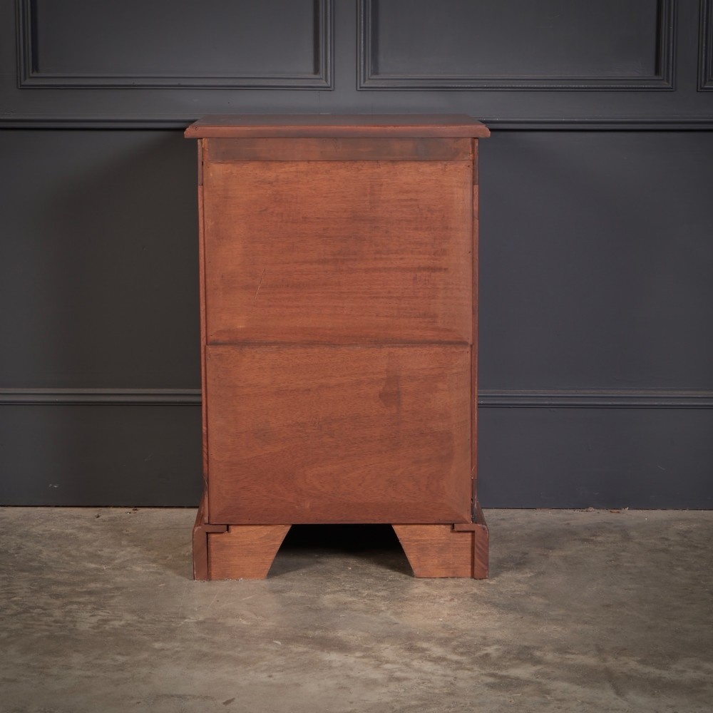 A matching pair of antique Victorian mahogany four-drawer bedside chests featuring plinth bases and brass card-pull handles. View XII