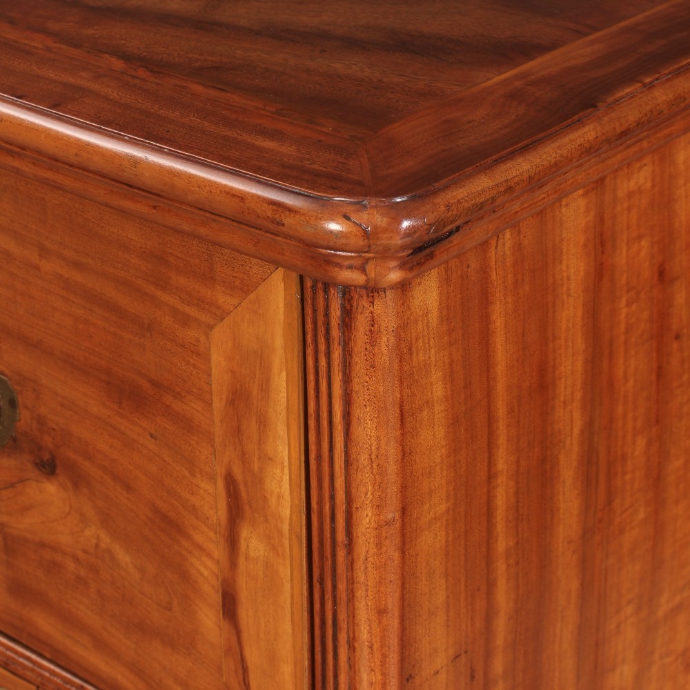 A Victorian two-part camphor wood military campaign chest featuring a secretaire top drawer, flush brass recessed handles, and turned bun feet. View X