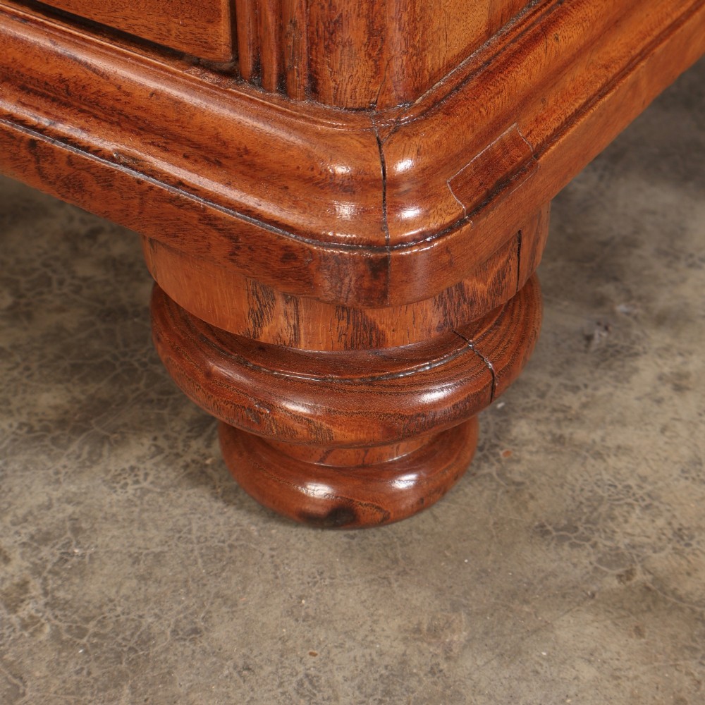 A Victorian two-part camphor wood military campaign chest featuring a secretaire top drawer, flush brass recessed handles, and turned bun feet. View XI