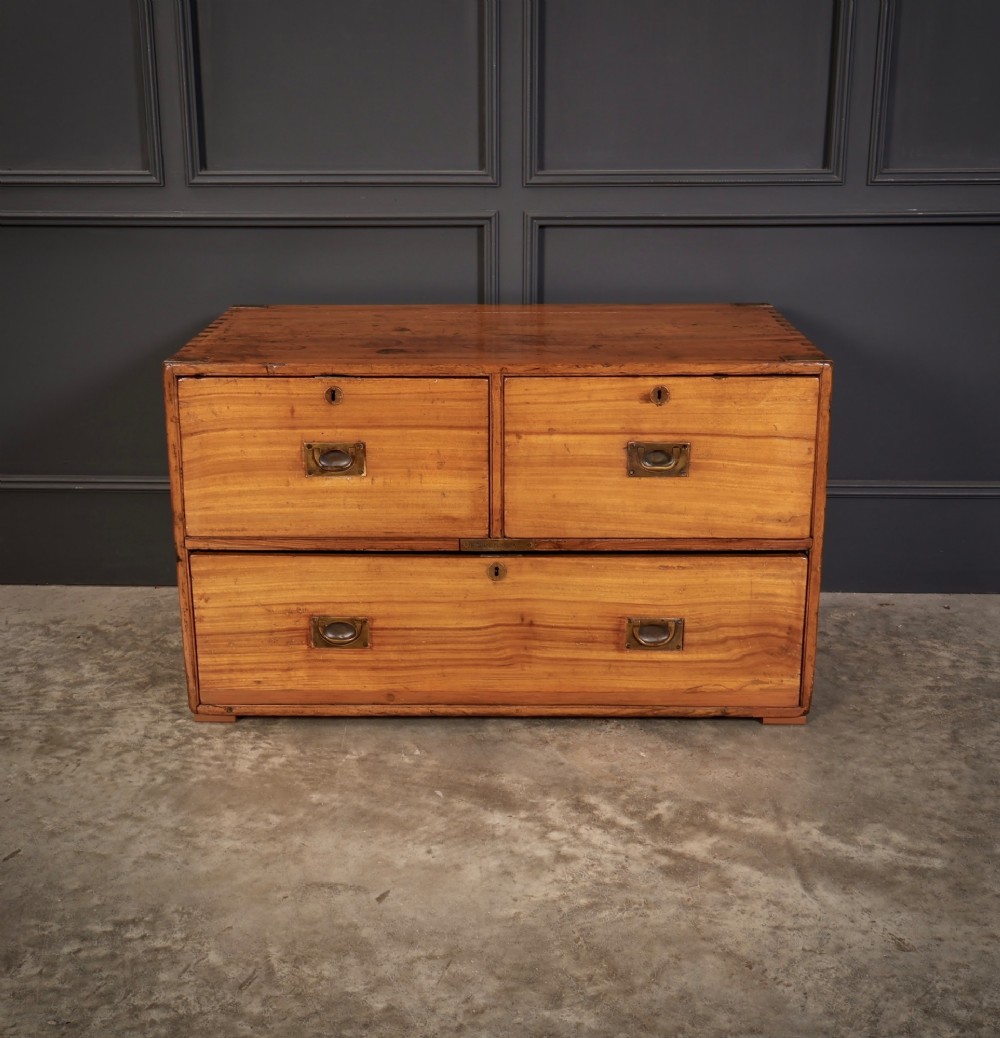 A low rectangular camphor wood campaign chest featuring three drawers with recessed brass handles, brass corner straps, and side carrying handles. View IV