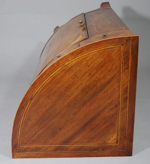 fig 3. Mahogany inlaid bow-fronted corner cupboard