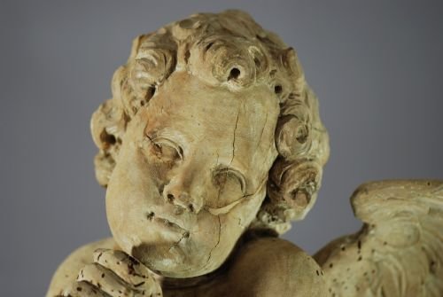 fig 3. Pair of mid 17thc limewood winged cherubs