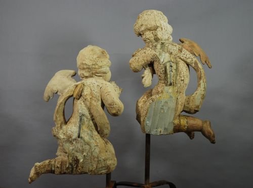 fig 4. Pair of mid 17thc limewood winged cherubs