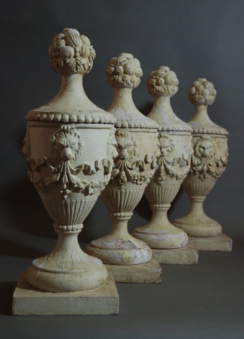 Set of Four Carved Wooden Urns with a Painted Finish