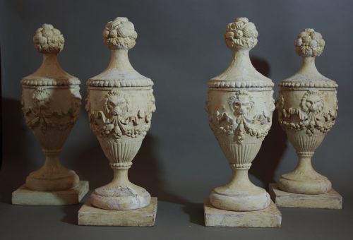 fig 1. Set of four carved wooden urns with a painted finish