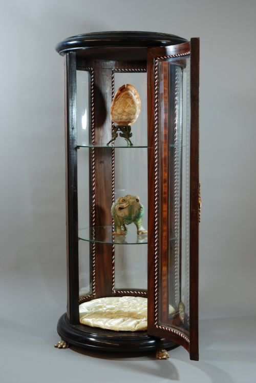 fig 1. Glazed cylinder shaped display case 