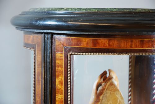 fig 2. Glazed cylinder shaped display case 
