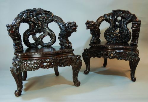 Pair of Heavily Carved Chinese Dragon Armchairs