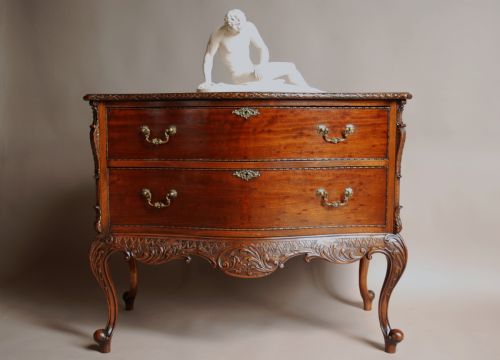 fig 1. Early 20th century mahogany Chippendale revival commode of serpentine form