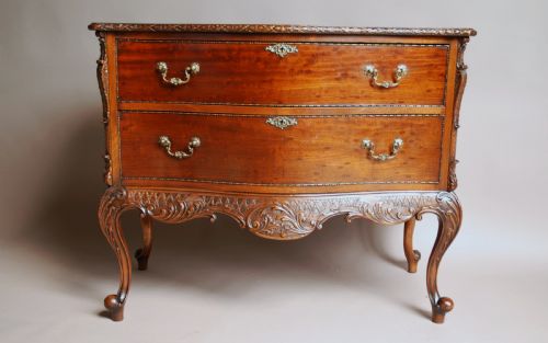 fig 2. Early 20th century mahogany Chippendale revival commode of serpentine form