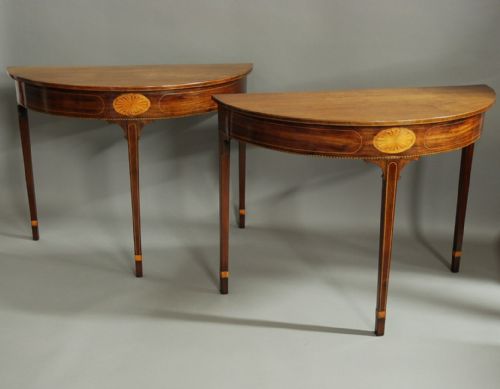 fig 1. Pair of 18thc mahogany console tables of demilune form