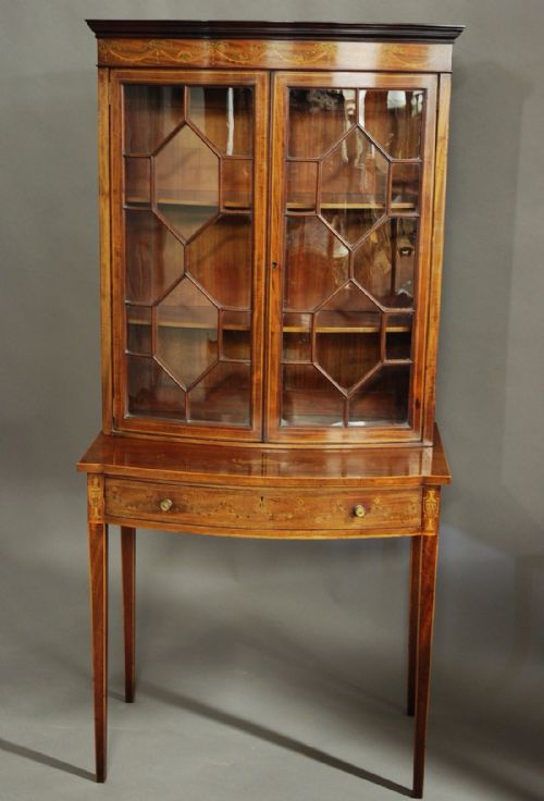 fig 1. Edwardian inlaid mahogany bow front glazed display cabinet