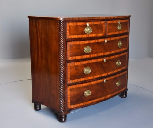 fig 1. Early 19th century mahogany and satinwood banded bow front chest of drawers