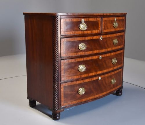 fig 2. Early 19th century mahogany and satinwood banded bow front chest of drawers