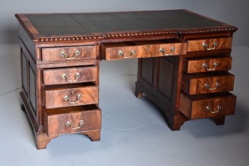 fig 2. Early 20th century mahogany pedestal desk with inverted breakfront green leather top